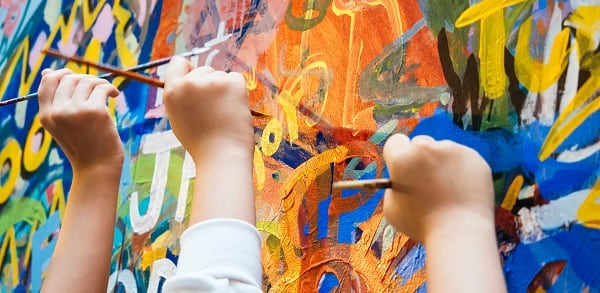 Kids hands with Colourful Paint Background